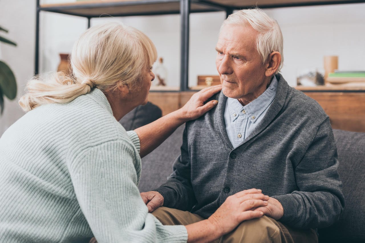A man with dementia communicating with his wife.